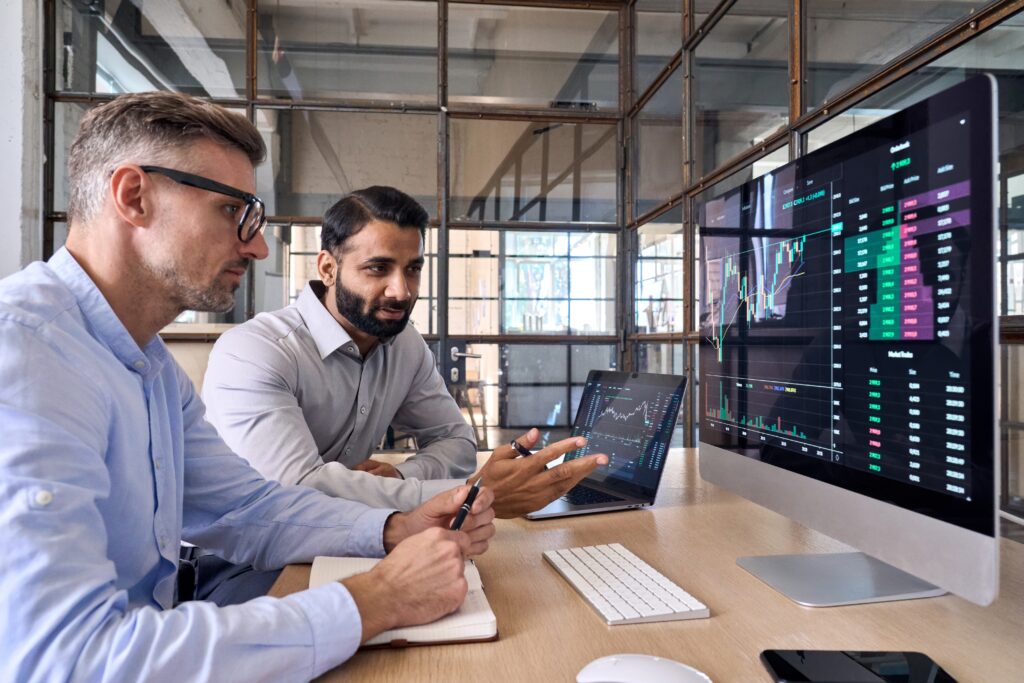 Two diverse businessmen discussing details about the Custody Rule & annual RIA Surprise Audit