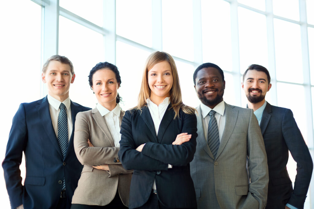 401k audit team of diverse business people looking at camera and smiling