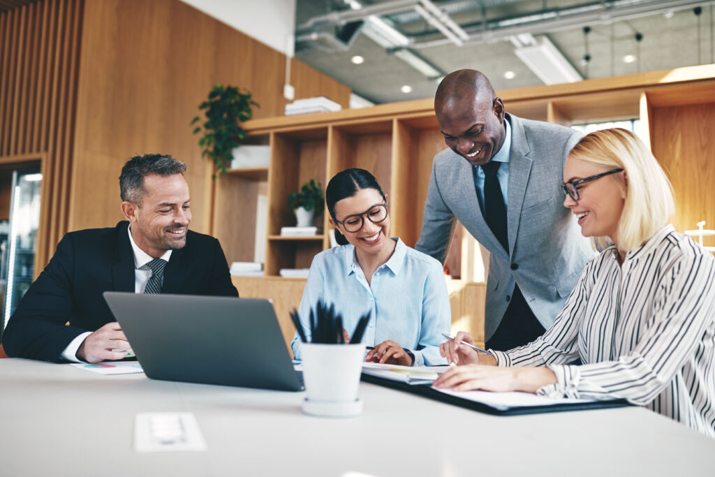 Four accountants in an audit firm having a meeting together