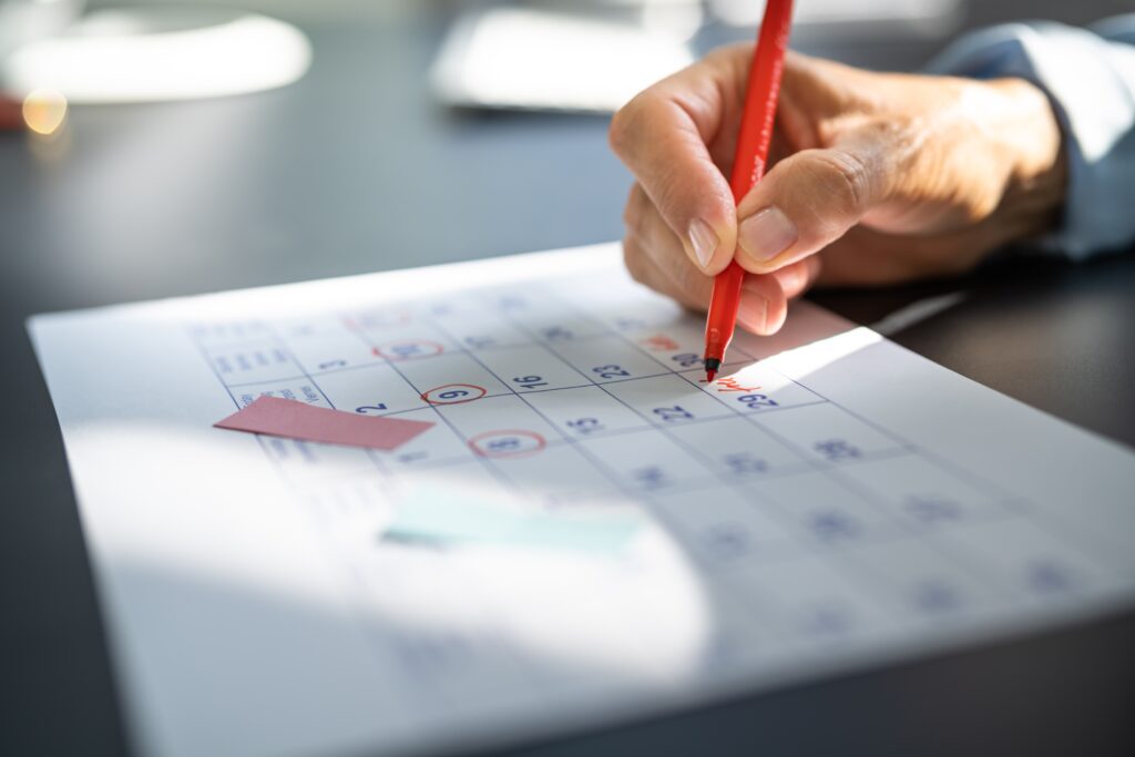 A plan sponsor circling their 401k plan audit deadline on a calendar in red pen