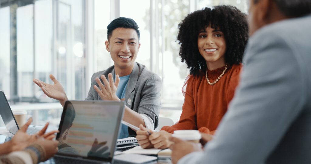 A woman and man who work for a nonprofit talking with their CPA auditor during their nonprofit annual audit