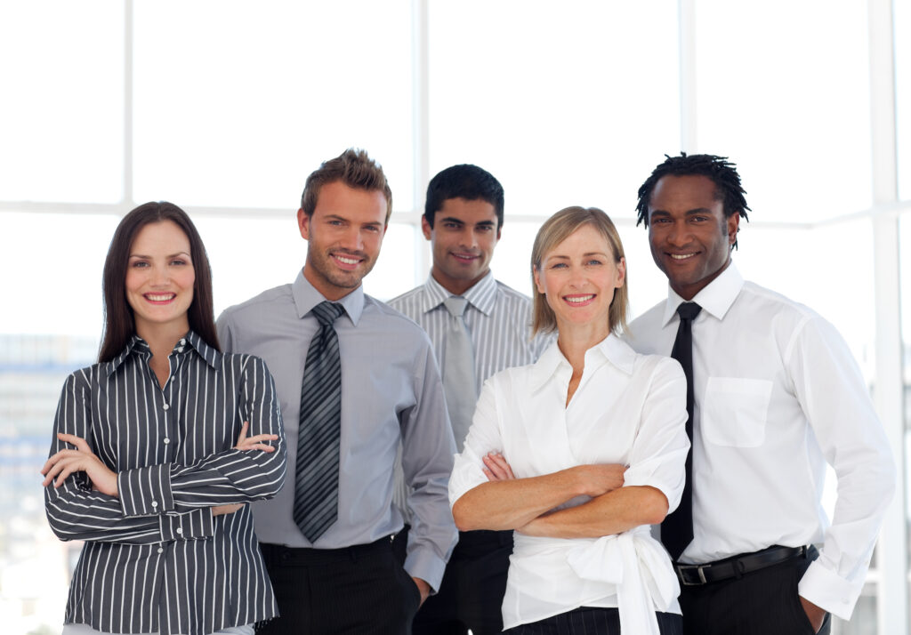 A group of people in business attire who each hold key roles during a public company audit