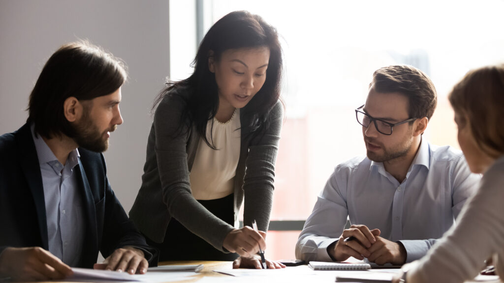 A professional accountant reviewing audited accounts to determine the right time for the business to get an audit.