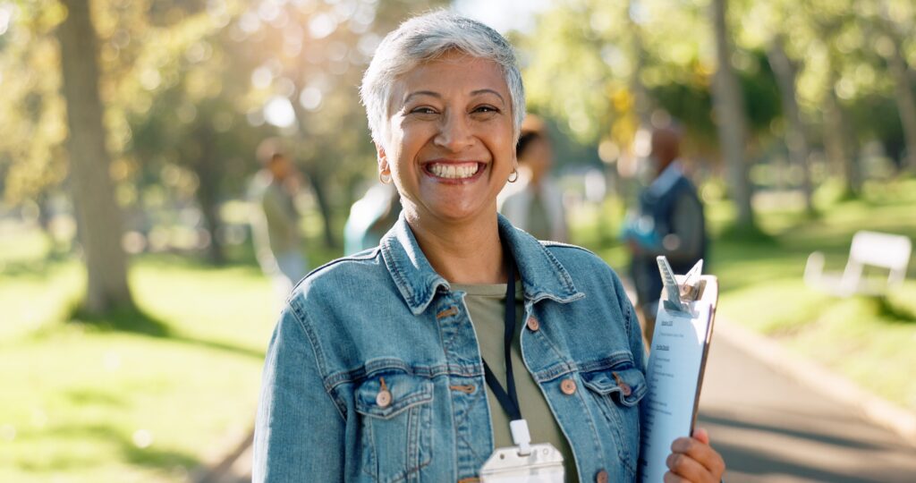 Smiling woman manages donation logistics for a nonprofit organization that relies on the expertise of non profit audit firms.