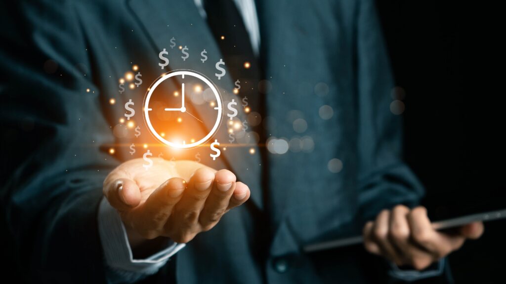 Audited financials concept shown by a business professional holding a digital clock and dollar icons over an open hand.